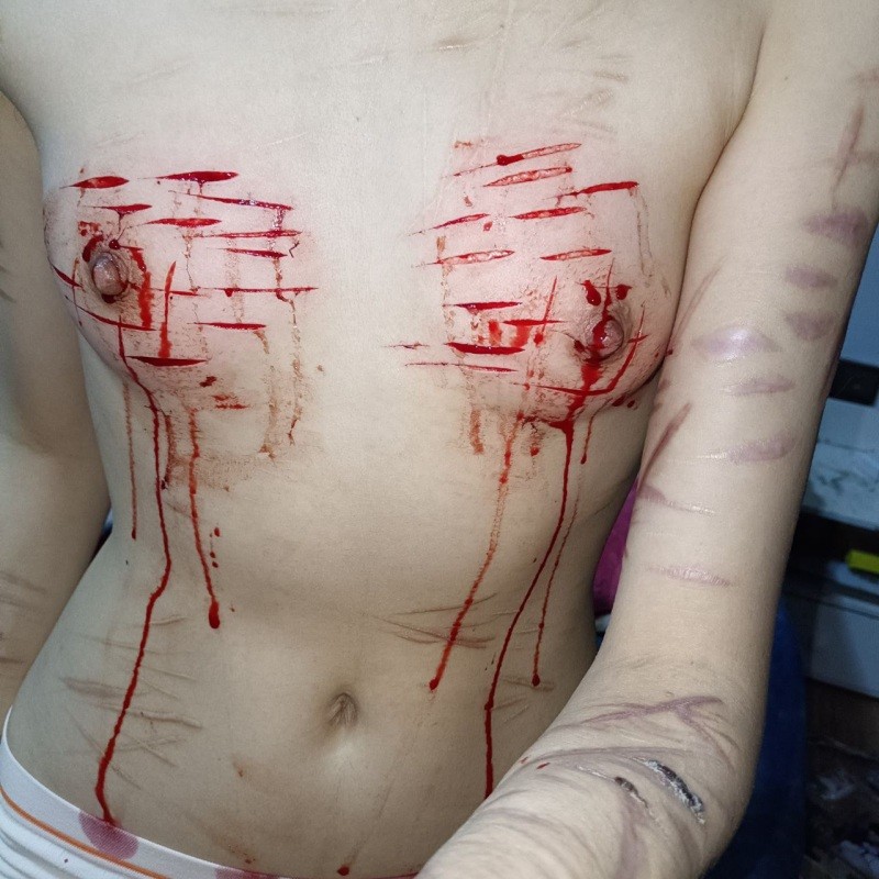 Bloody breasts cut twice